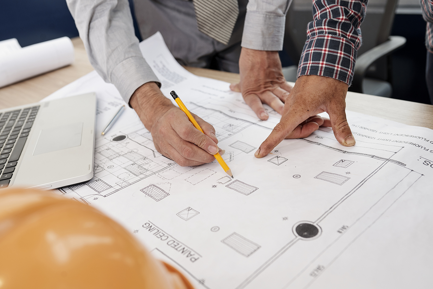 Architects drawing blueprint